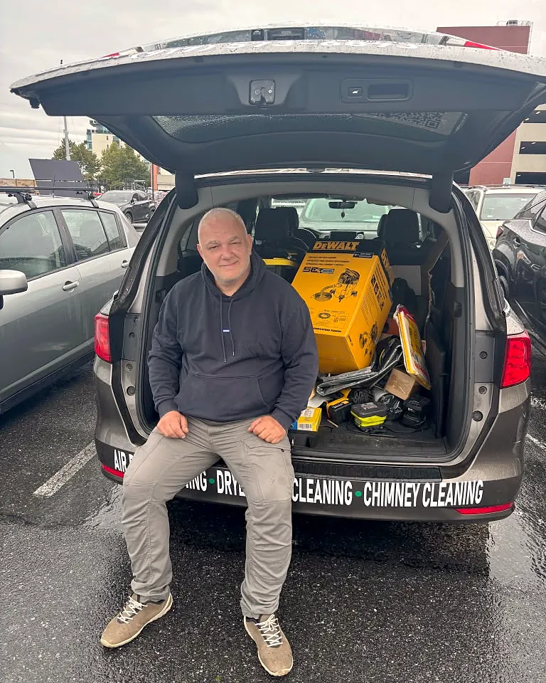 Air duct cleaning in Middletown, NY: Irakli Kvizhinadze, owner of Your Neighbor's Air Care, in the back of his service van with his tools