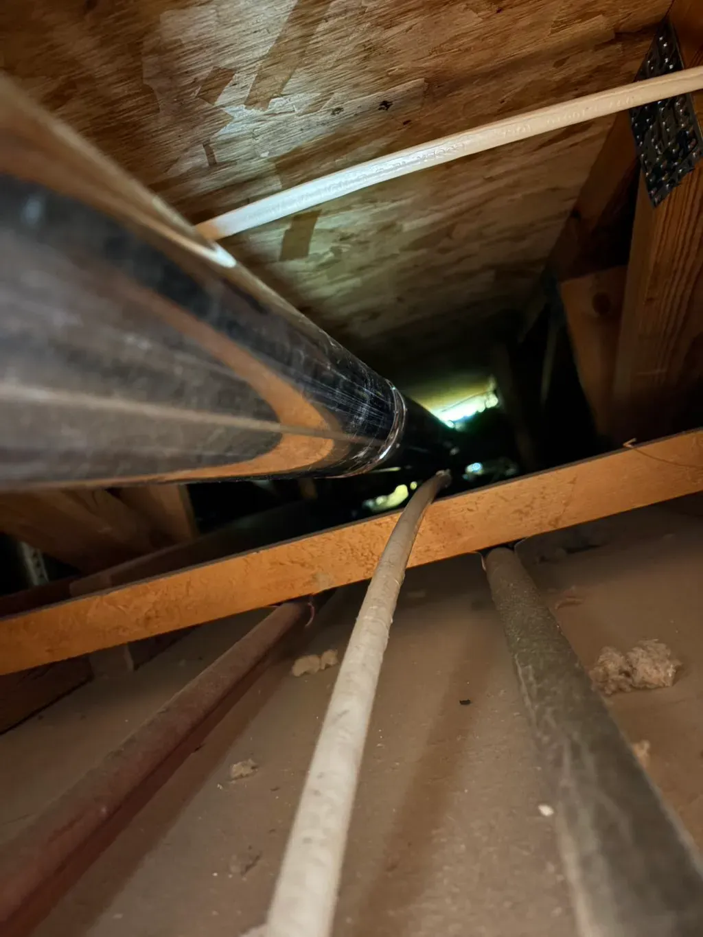 Air duct cleaning in Wappingers Falls, NY by Your Neighbor's Air Care: example job photo of rods in attic ductwork