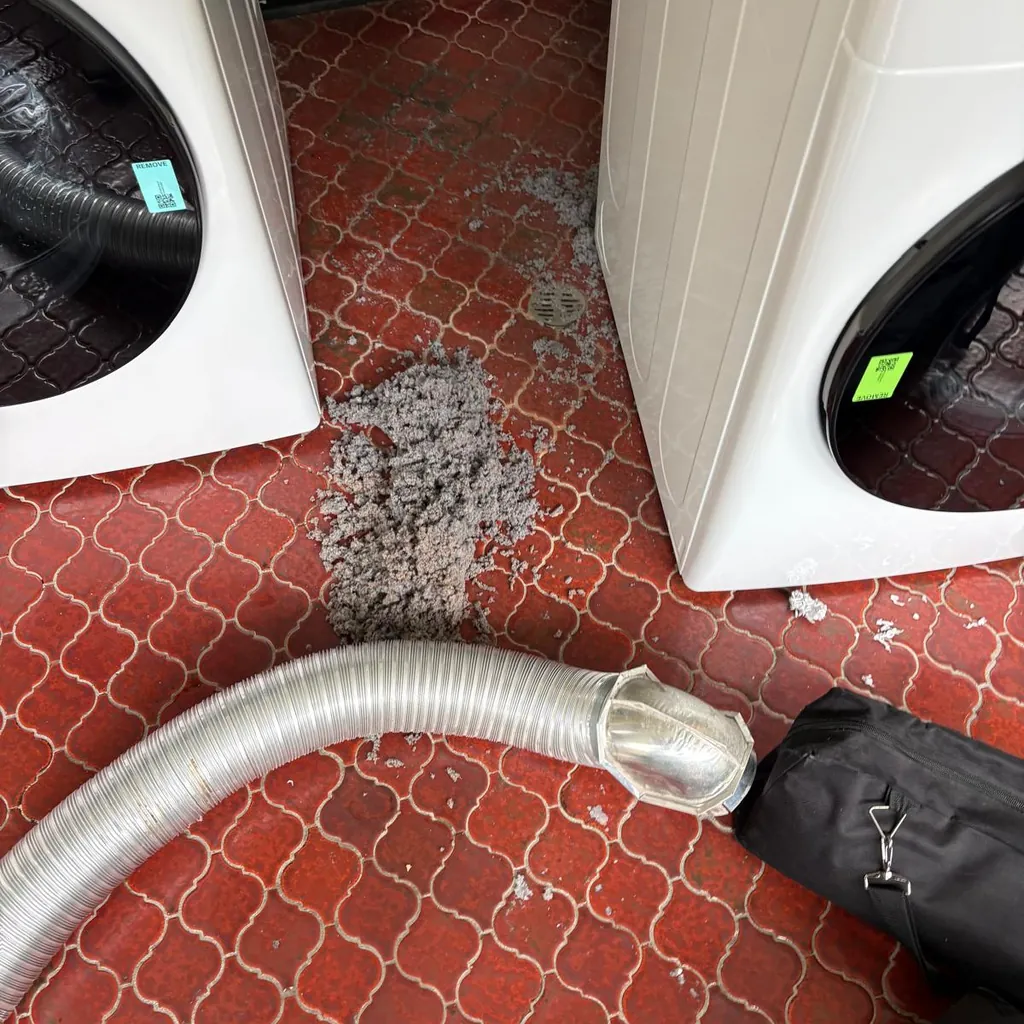 Dryer vent cleaning in Beacon, NY: example job photo of lint out of a dryer run on a laundry room floor