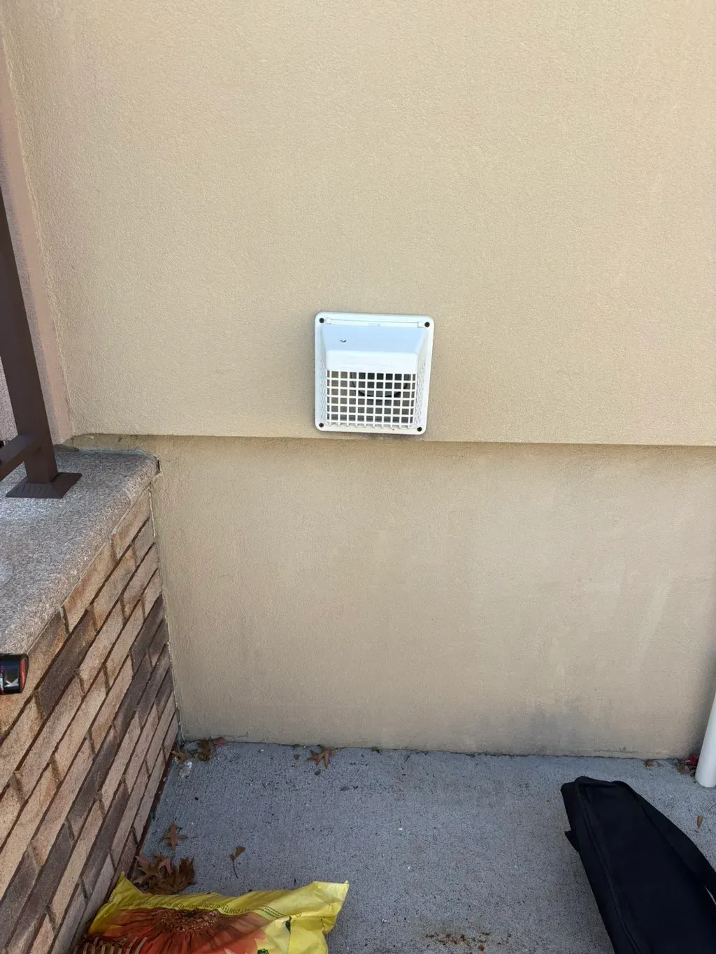 Dryer vent cleaning in Beacon, NY by Your Neighbor's Air Care: example job photo of a dryer vent hood on an outside wall