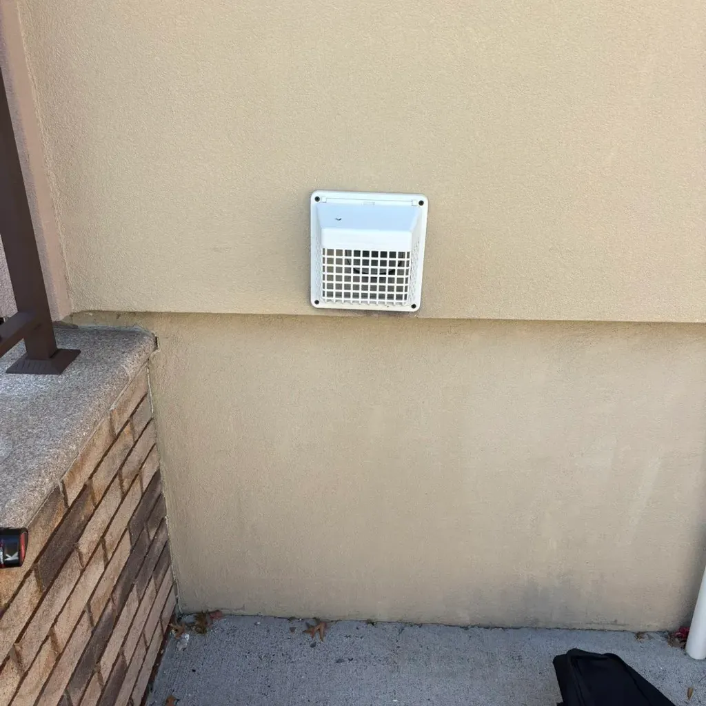 Dryer vent cleaning in Middletown, NY: example job photo of the outside hood where the run ends