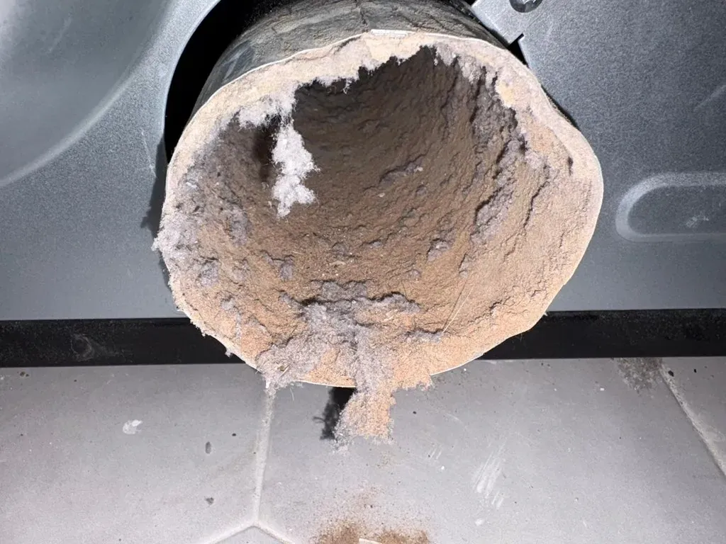 Dryer vent cleaning in Middletown, NY by Your Neighbor's Air Care: example job photo of a duct packed with lint