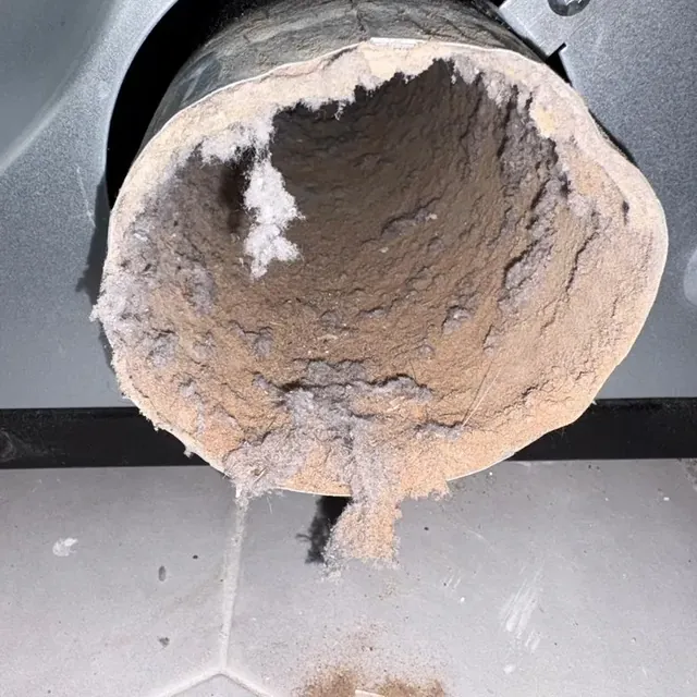 Dryer vent cleaning in Warwick, NY: example job photo of a dryer duct packed with lint