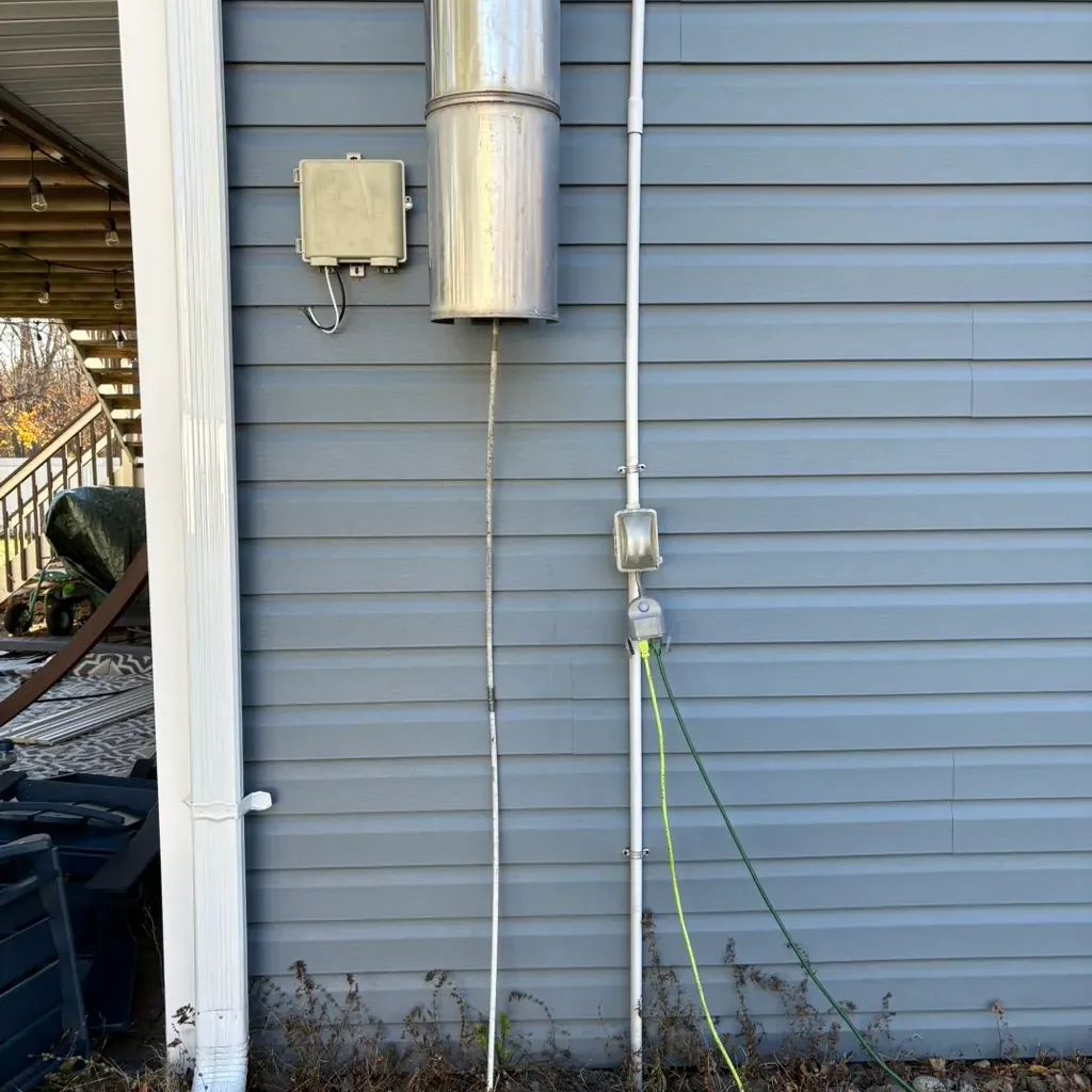 Dryer vent outlet on the outside wall of a sided house