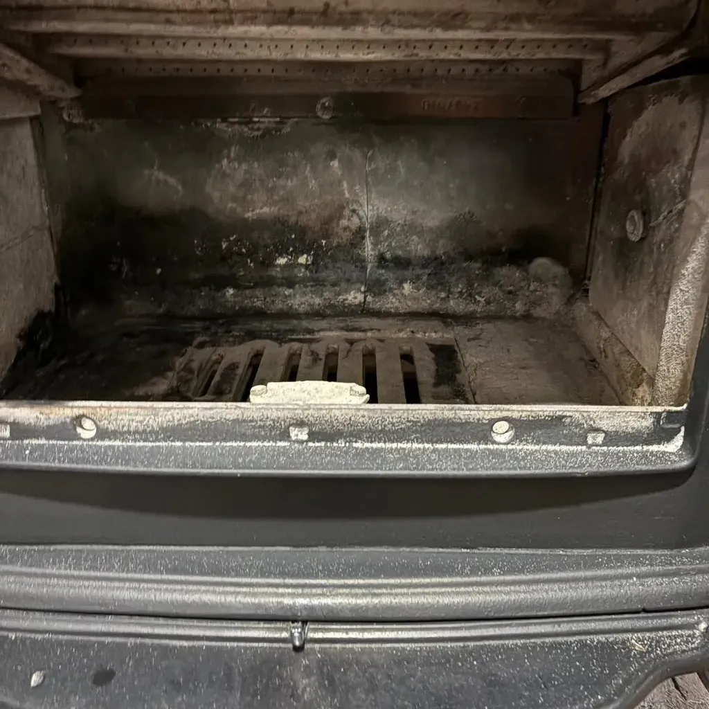 The same wood stove insert cleaned, baffle and firebox clear