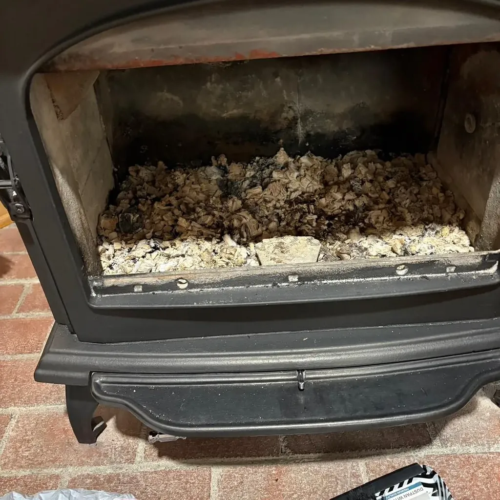 Wood stove insert full of ash before the service